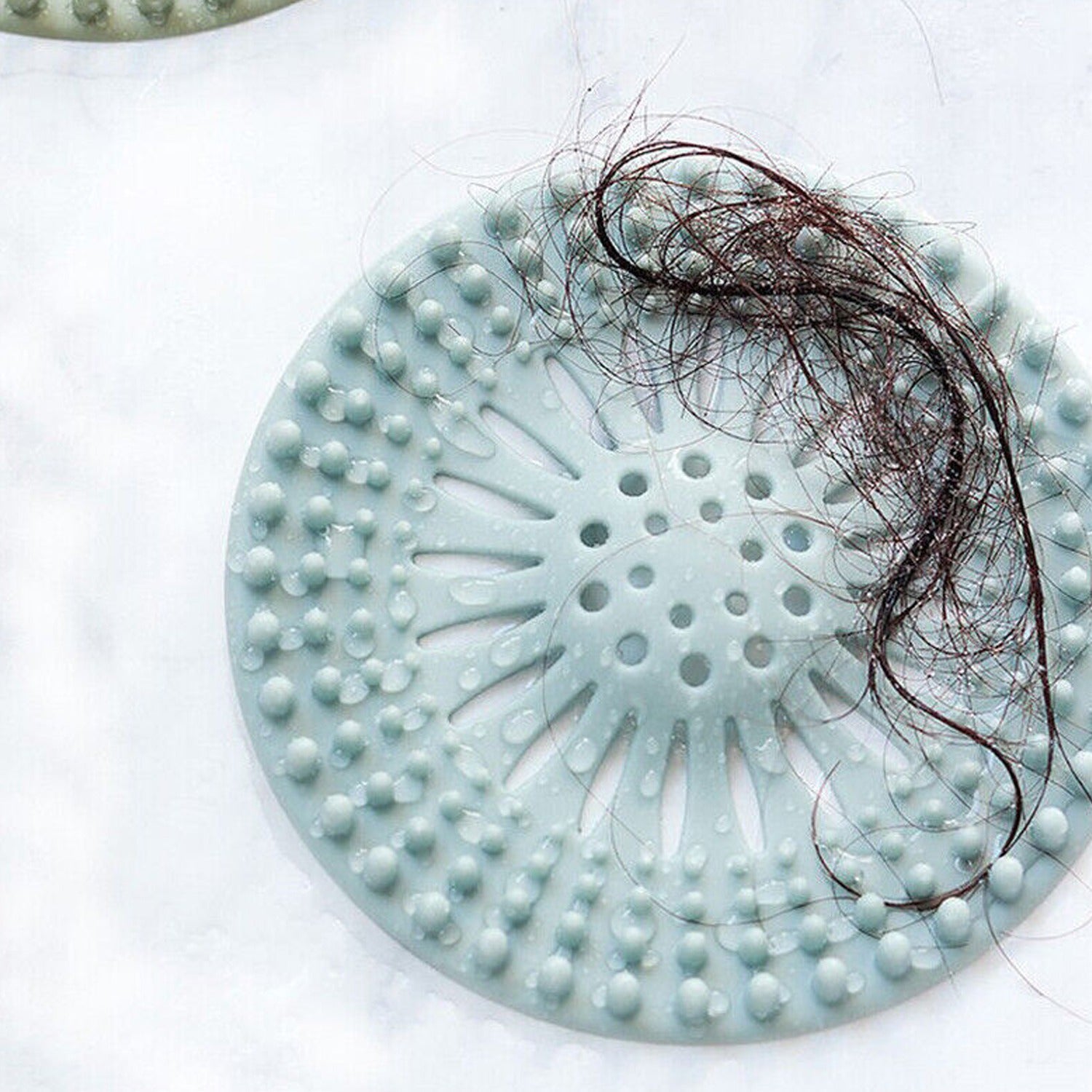 Anti-odor silicone drain plug, insect-proof and effective hair trap for kitchen and bathroom drains. Anti-odor silicone drain plug, insect-proof and effective hair trap for kitchen and bathroom drains.